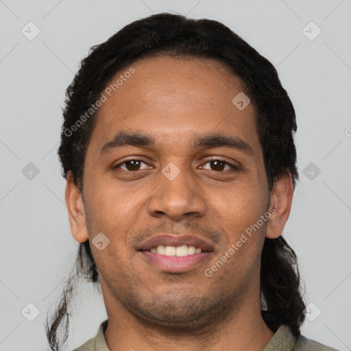 Joyful latino young-adult male with short  black hair and brown eyes