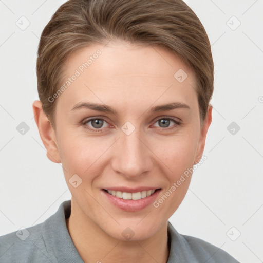 Joyful white young-adult female with short  brown hair and grey eyes