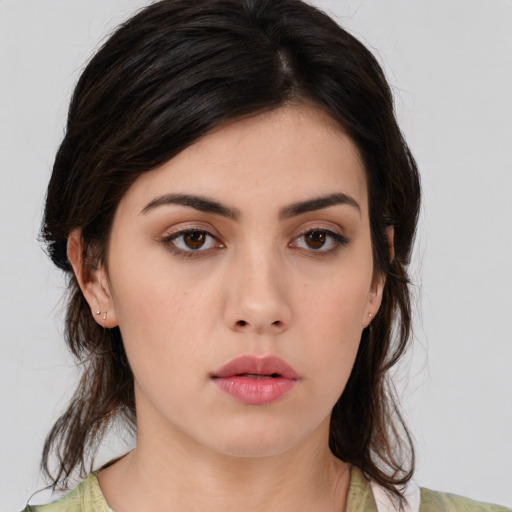 Neutral white young-adult female with medium  brown hair and brown eyes