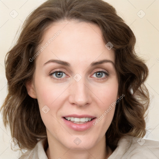 Joyful white young-adult female with medium  brown hair and blue eyes