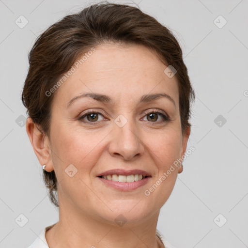 Joyful white adult female with short  brown hair and grey eyes