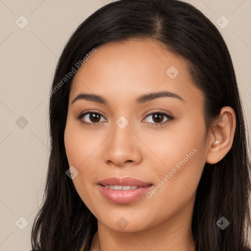 Joyful latino young-adult female with long  brown hair and brown eyes