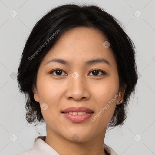 Joyful asian young-adult female with medium  brown hair and brown eyes