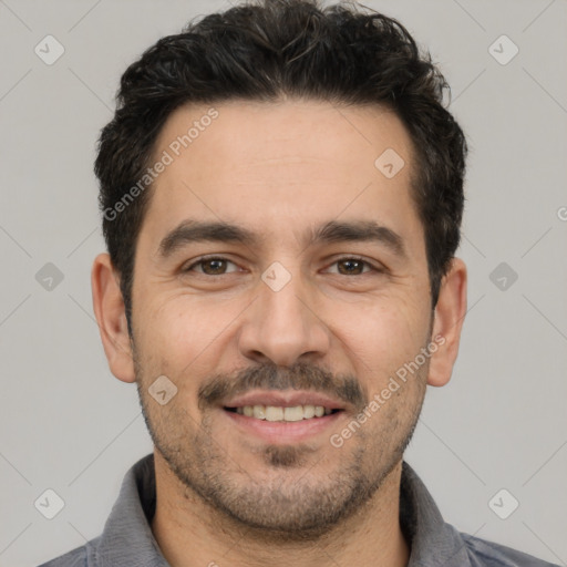 Joyful white young-adult male with short  black hair and brown eyes