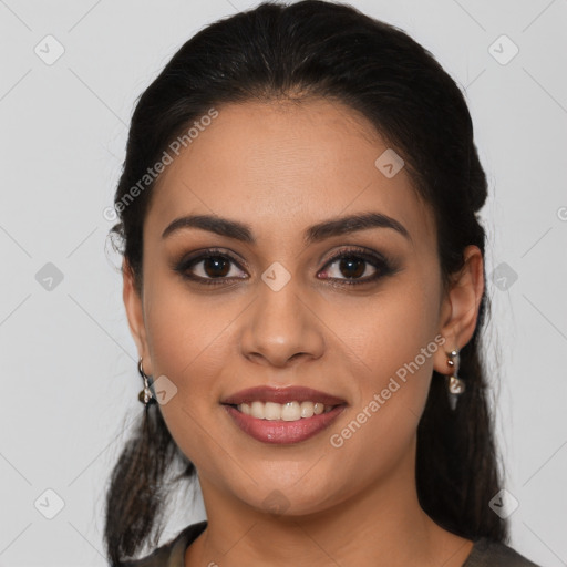 Joyful latino young-adult female with long  brown hair and brown eyes