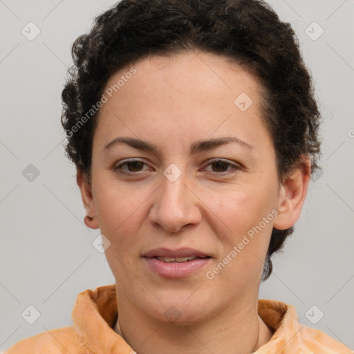 Joyful white adult female with short  brown hair and brown eyes