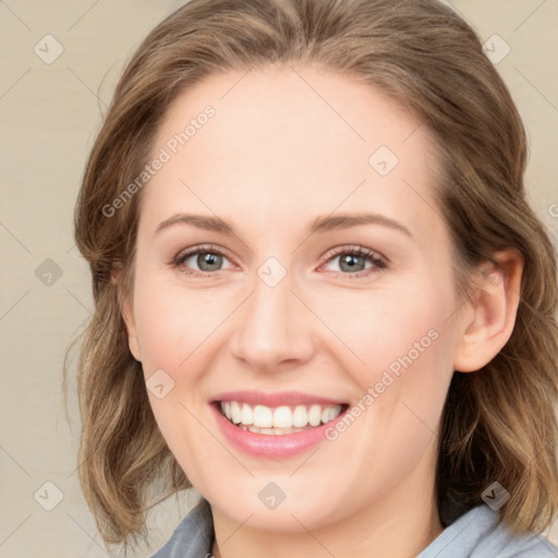 Joyful white young-adult female with medium  brown hair and blue eyes