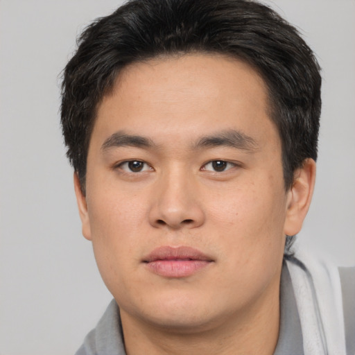 Neutral asian young-adult male with short  brown hair and brown eyes