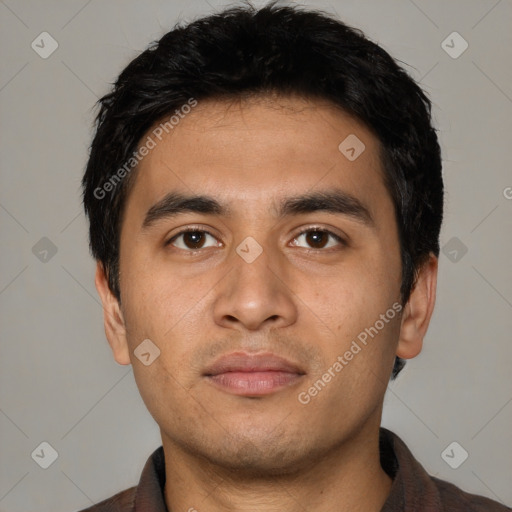 Neutral latino young-adult male with short  black hair and brown eyes