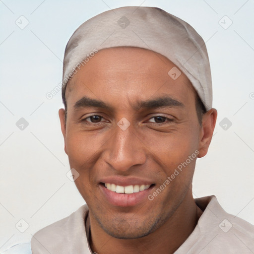 Joyful white young-adult male with short  black hair and brown eyes