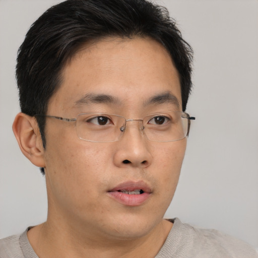 Neutral asian young-adult male with short  brown hair and brown eyes