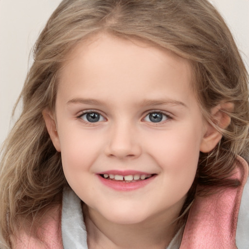 Joyful white child female with medium  brown hair and grey eyes