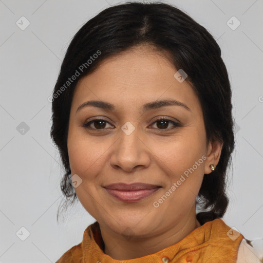 Joyful latino adult female with medium  brown hair and brown eyes