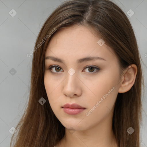 Neutral white young-adult female with long  brown hair and brown eyes