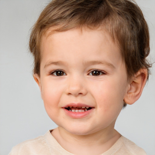 Joyful white child male with short  brown hair and brown eyes