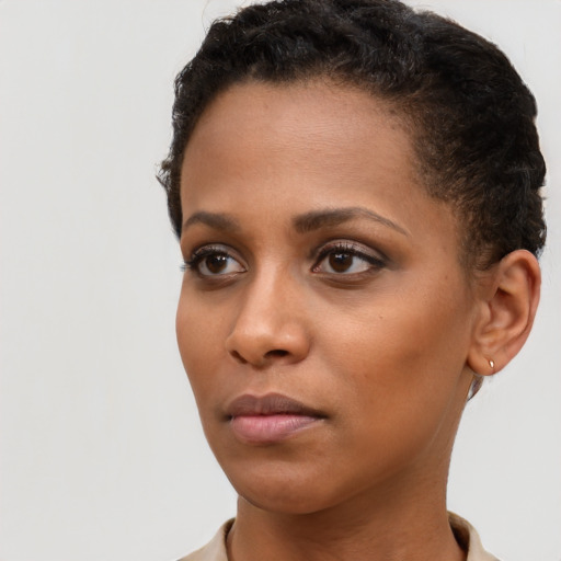 Neutral black young-adult female with short  brown hair and brown eyes
