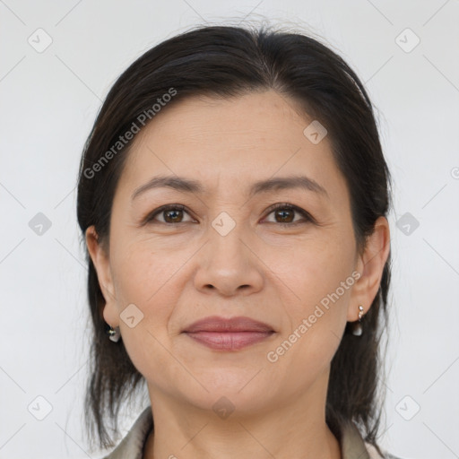 Joyful white adult female with medium  brown hair and brown eyes