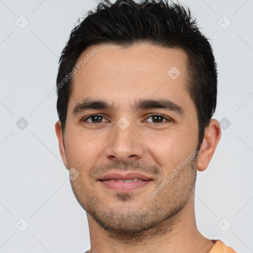 Joyful white young-adult male with short  black hair and brown eyes