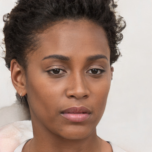 Neutral black young-adult female with short  brown hair and brown eyes