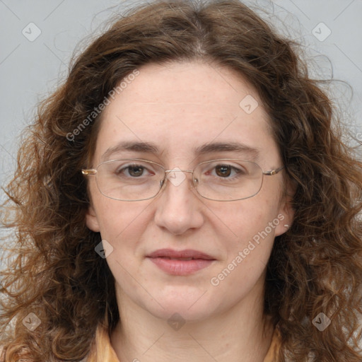 Joyful white adult female with long  brown hair and brown eyes