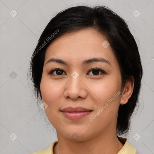 Joyful asian young-adult female with medium  brown hair and brown eyes