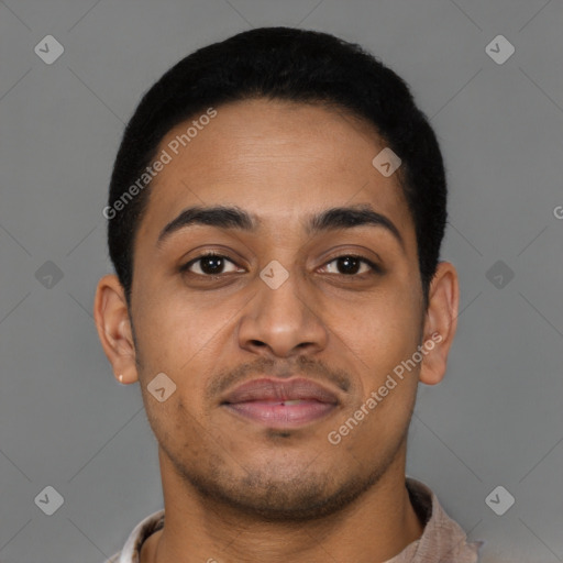 Joyful latino young-adult male with short  brown hair and brown eyes