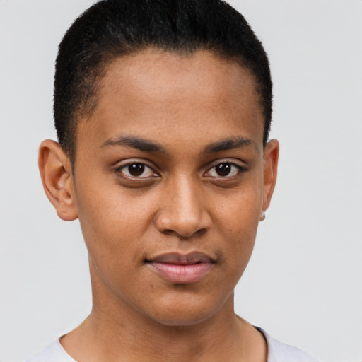 Joyful black young-adult female with short  brown hair and brown eyes