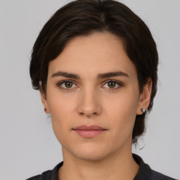 Neutral white young-adult female with medium  brown hair and brown eyes