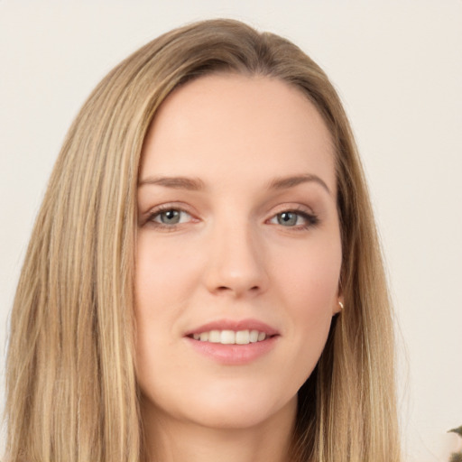 Joyful white young-adult female with long  brown hair and green eyes