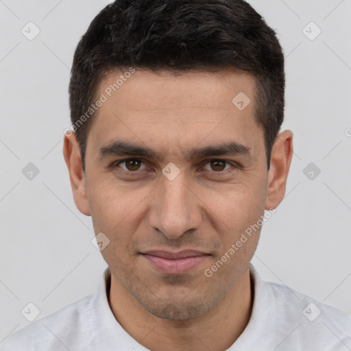 Joyful white young-adult male with short  brown hair and brown eyes