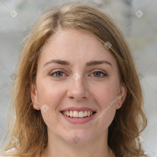 Joyful white young-adult female with medium  brown hair and green eyes