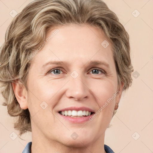 Joyful white adult female with medium  brown hair and blue eyes