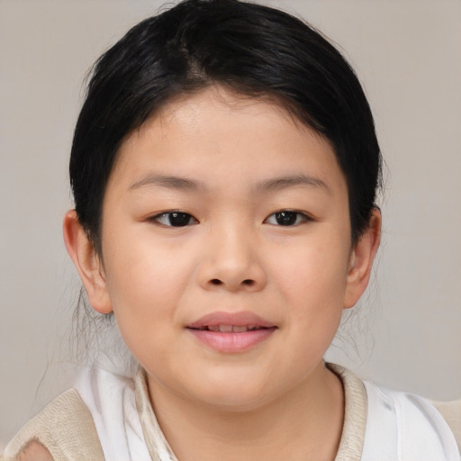 Joyful asian child female with medium  brown hair and brown eyes