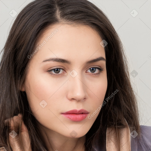 Neutral white young-adult female with long  brown hair and brown eyes