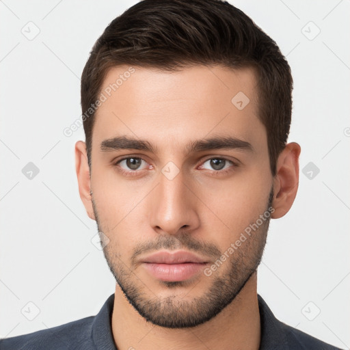 Neutral white young-adult male with short  brown hair and brown eyes