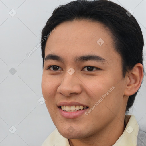 Joyful asian young-adult male with short  brown hair and brown eyes