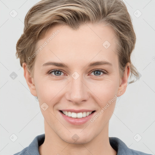 Joyful white young-adult female with short  brown hair and grey eyes