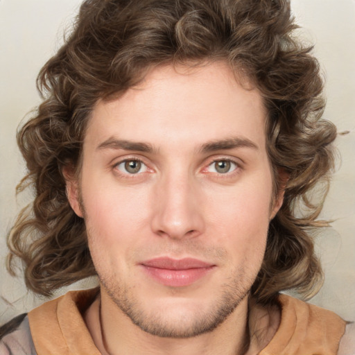 Joyful white young-adult male with medium  brown hair and brown eyes