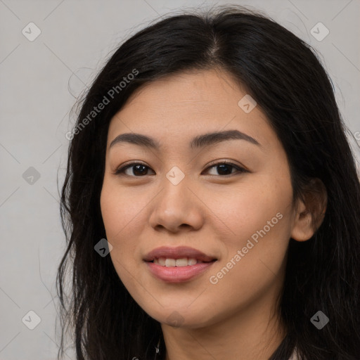 Joyful latino young-adult female with long  brown hair and brown eyes