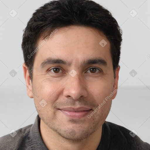 Joyful white adult male with short  brown hair and brown eyes