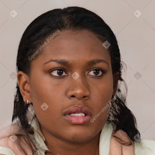 Neutral black young-adult female with medium  brown hair and brown eyes