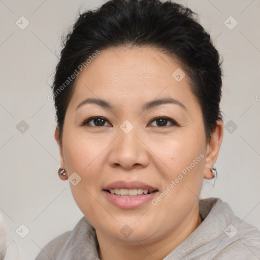 Joyful white adult female with short  brown hair and brown eyes