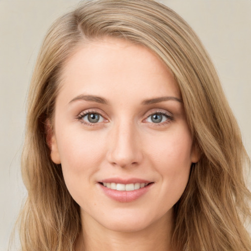 Joyful white young-adult female with long  brown hair and green eyes