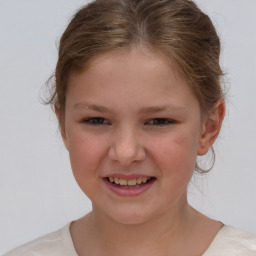 Joyful white child female with short  brown hair and brown eyes