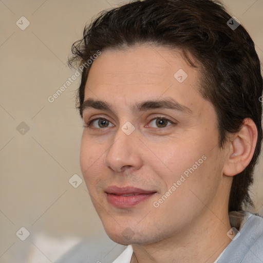 Joyful white young-adult male with medium  brown hair and brown eyes