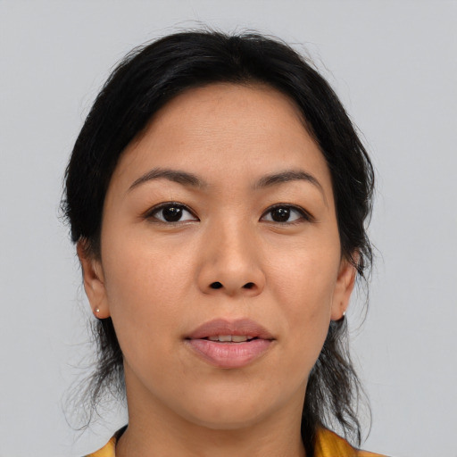 Joyful asian young-adult female with medium  black hair and brown eyes