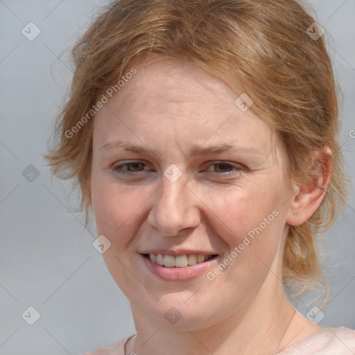 Joyful white adult female with medium  brown hair and blue eyes