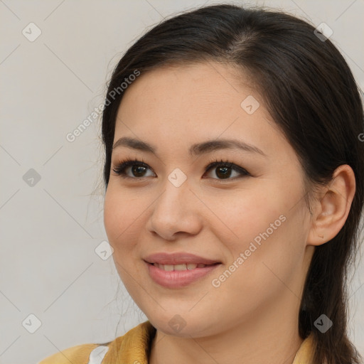 Joyful asian young-adult female with long  brown hair and brown eyes