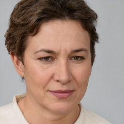 Joyful white adult female with short  brown hair and brown eyes