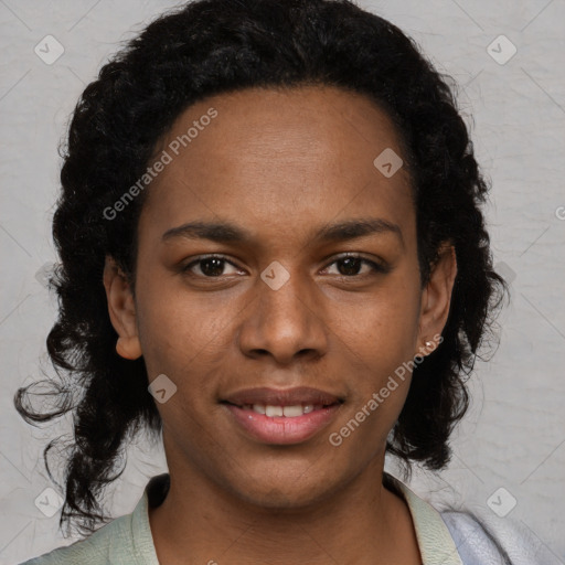 Joyful black young-adult female with long  brown hair and brown eyes